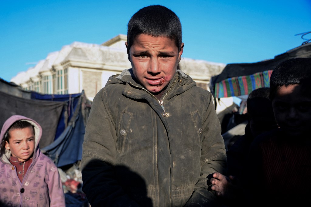 A boy displaced from his home because of drought in Kandahar province who has sought shelter in a temporary camp set up near Kandahar city. Photo: Javed Tanveer/AFP (January 2022)