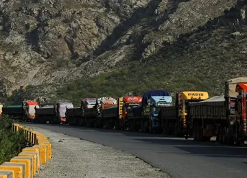 Trucks loaded with supplies park along a road leading to the Torkham border, after Pakistan closed border crossings with Afghanistan, on October 15. — Reuters